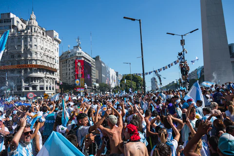Argentinians celebrate in a bustling city square.