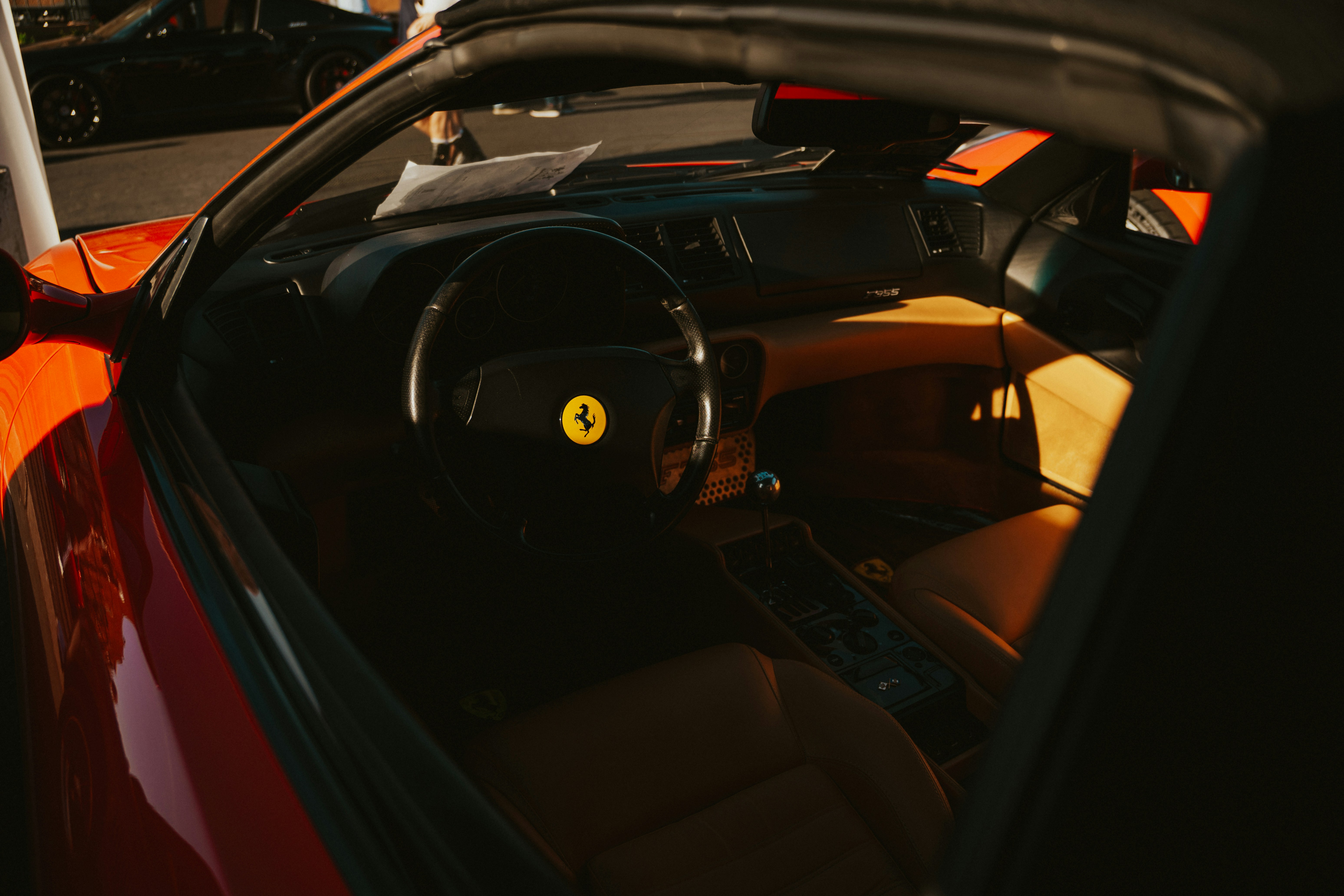 Ferrari interior cockpit with leather seats and carbon fiber details - rent Ferrari NYC