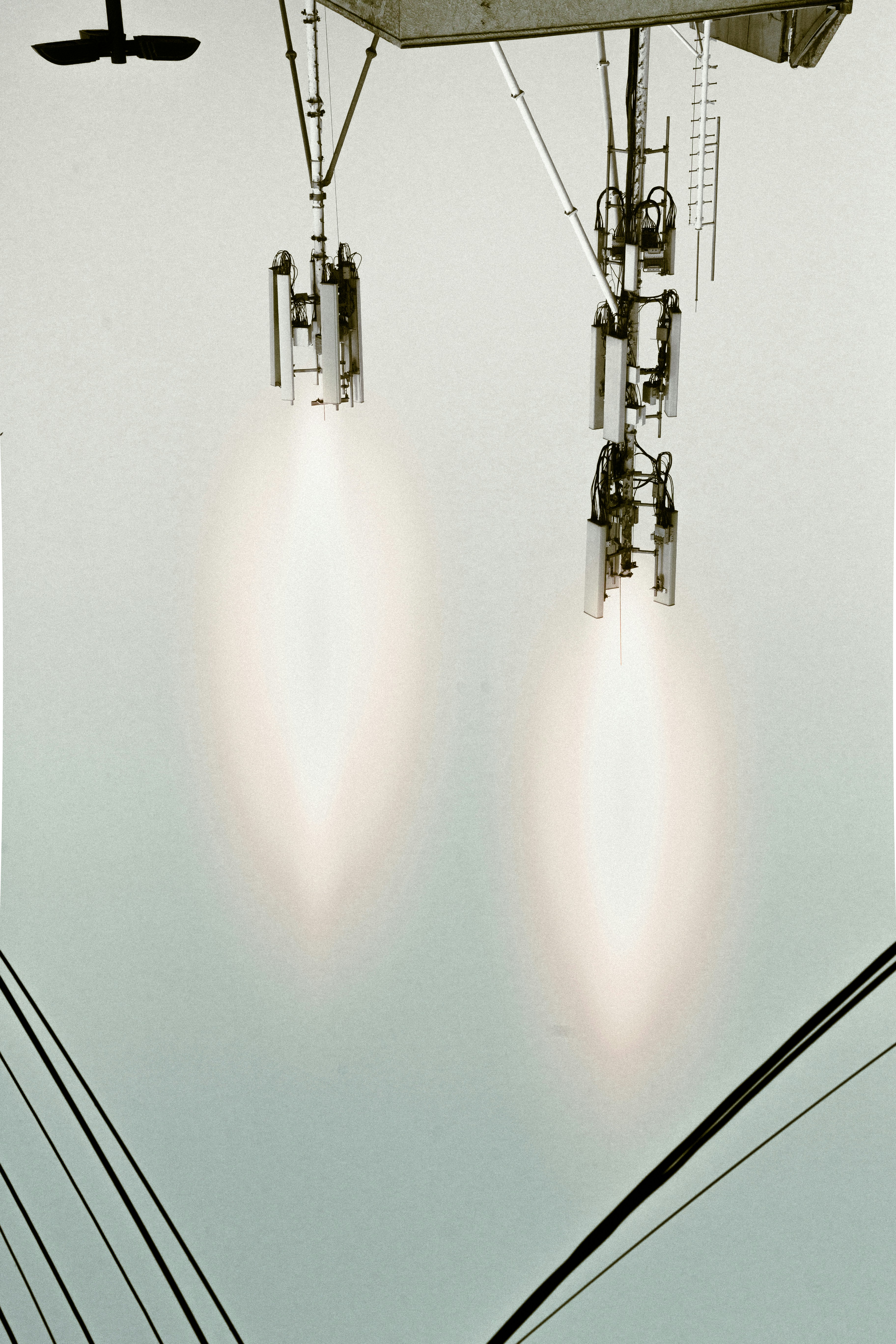 Two rockets are firing, creating bright exhaust plumes.