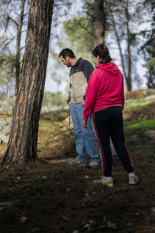 Two people are exploring the forest together