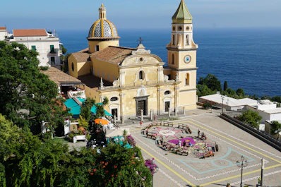 A picturesque church sits near the ocean.