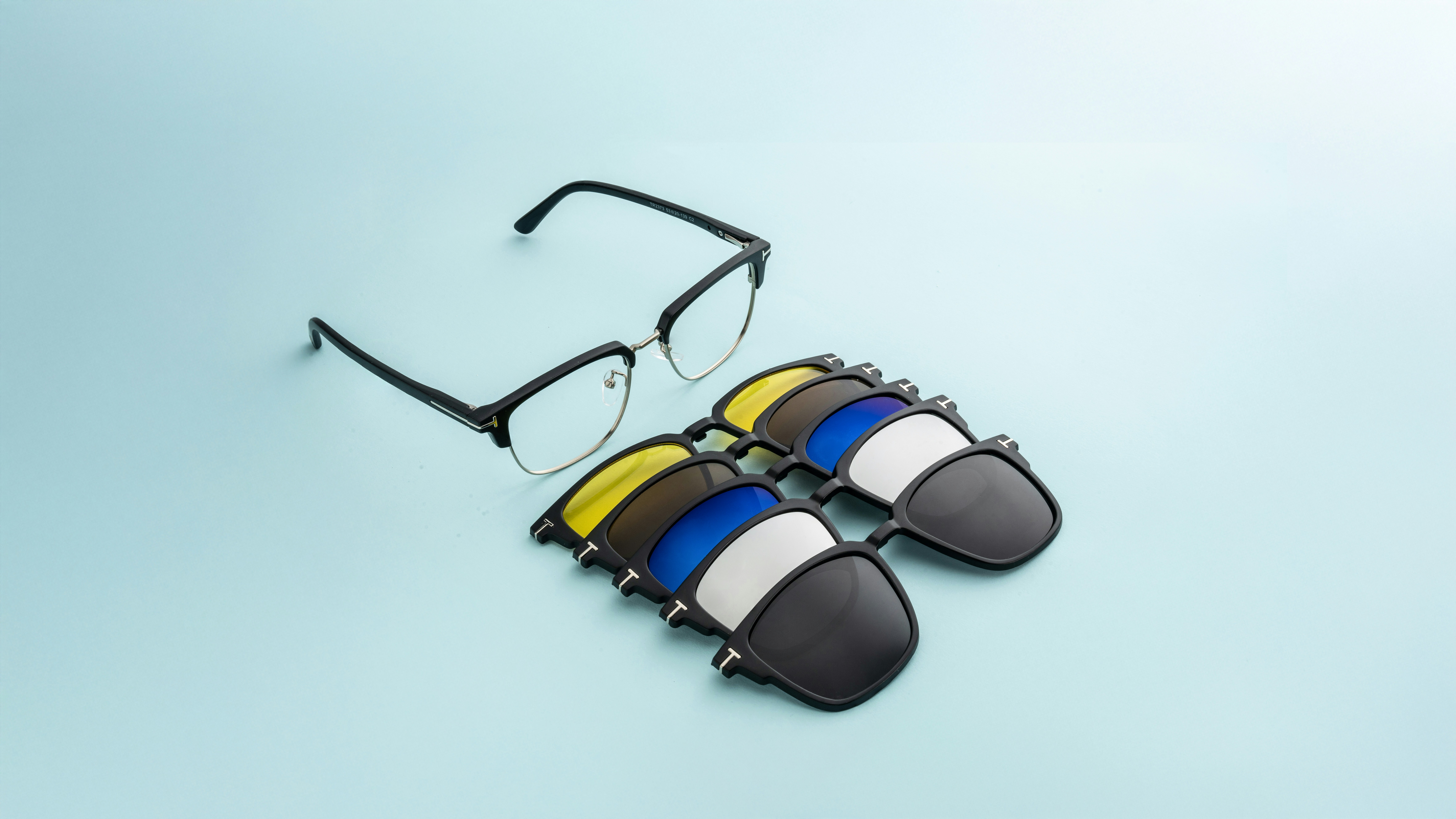 Glasses with multiple tinted magnetic lenses.