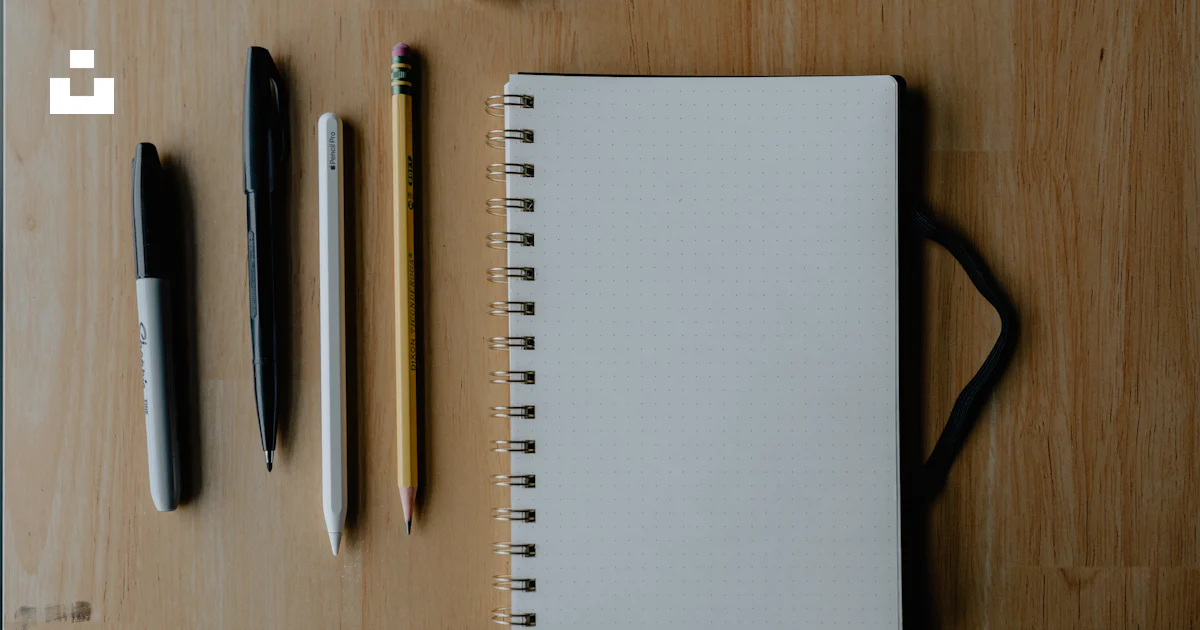 Notebook and writing supplies on wooden surface. photo – Free Art Image ...