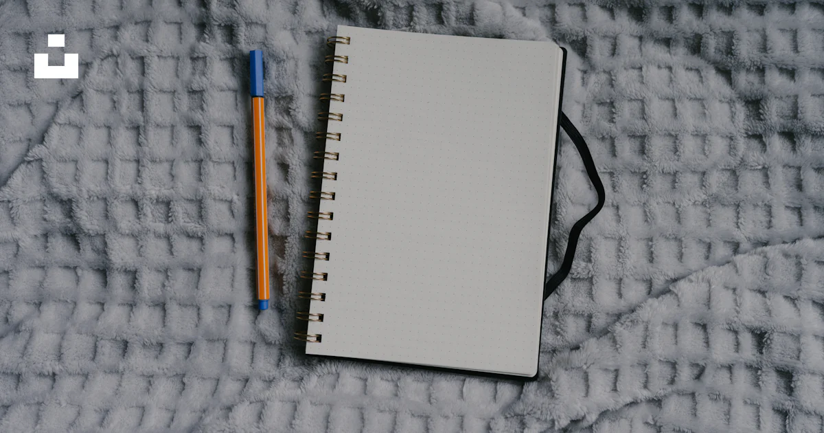 Notebook and pen sit on a textured surface. photo – Free Art Image on ...
