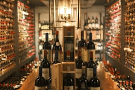 A wine cellar showcases various bottles of wine.
