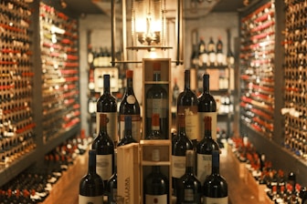 A wine cellar showcases various bottles of wine.