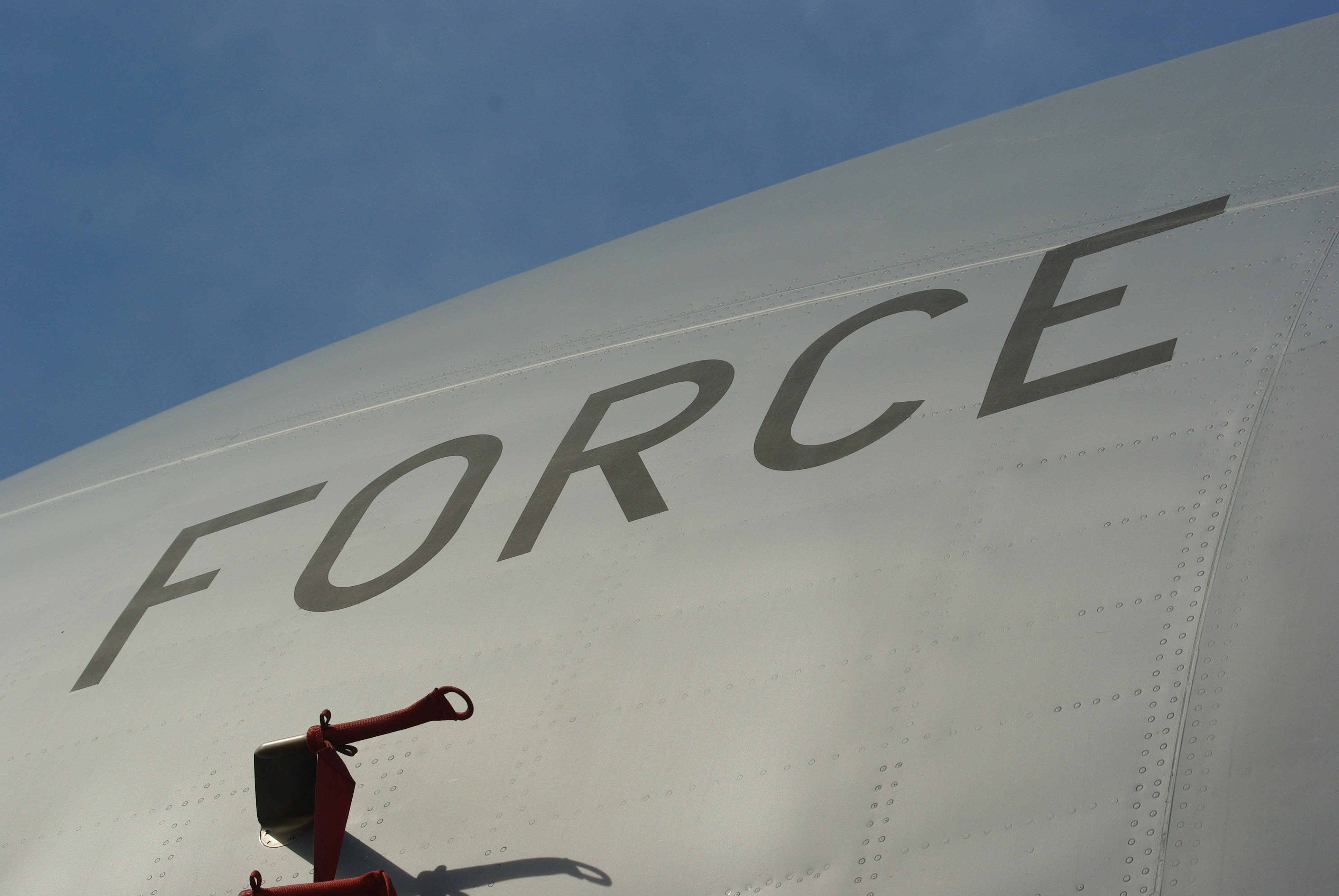 A plane's fuselage with "force" written on it.