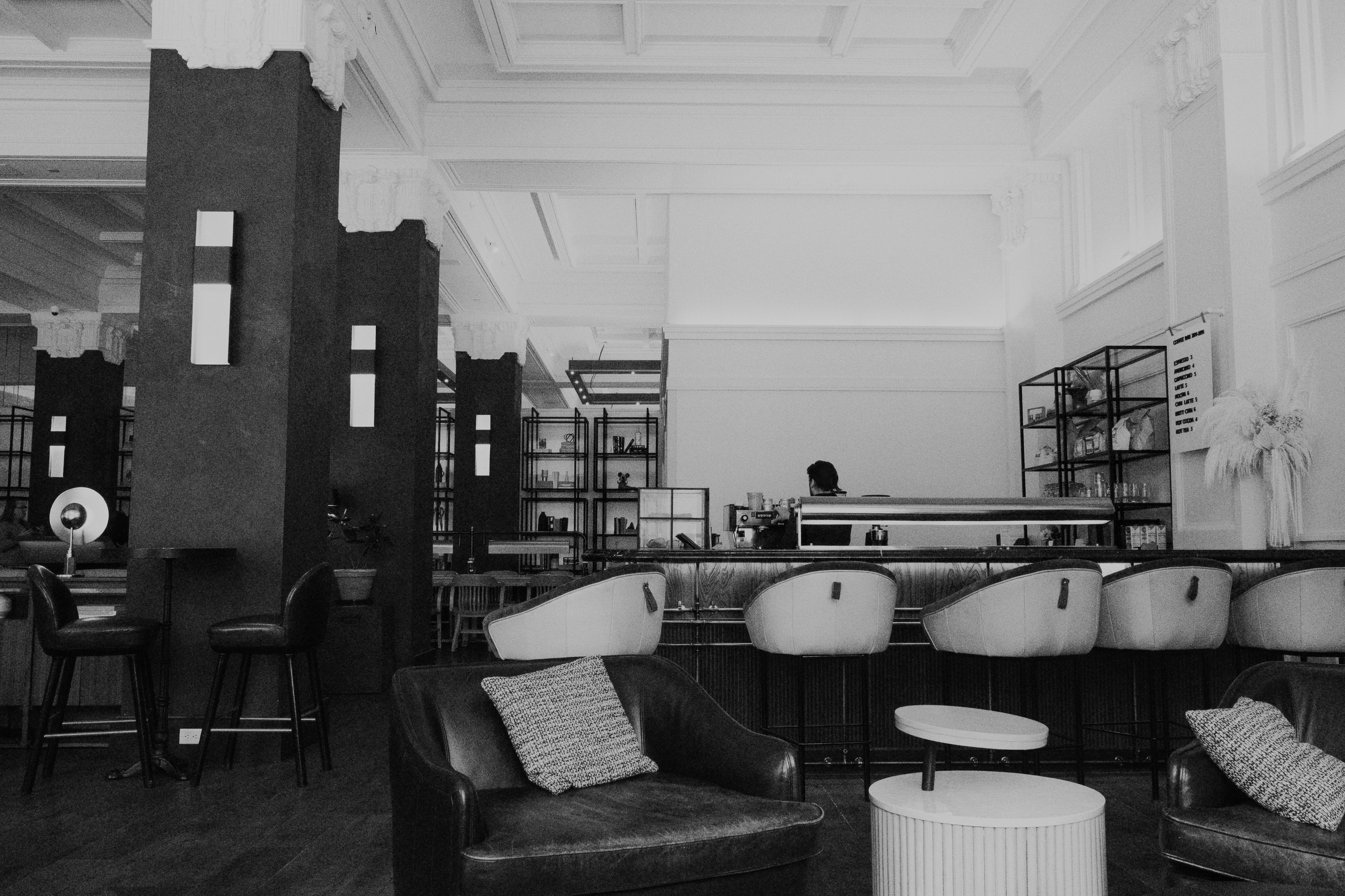 A black and white image of a restaurant interior.