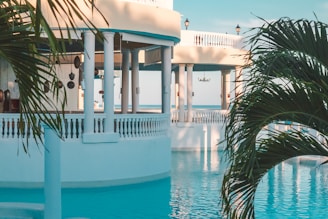 Elegant architecture overlooks a serene pool.