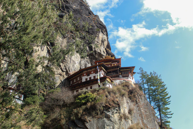 Tiger's Nest Monastery (Paro Taktsang) clinging to a cliff face high above the Paro valley in Bhutan