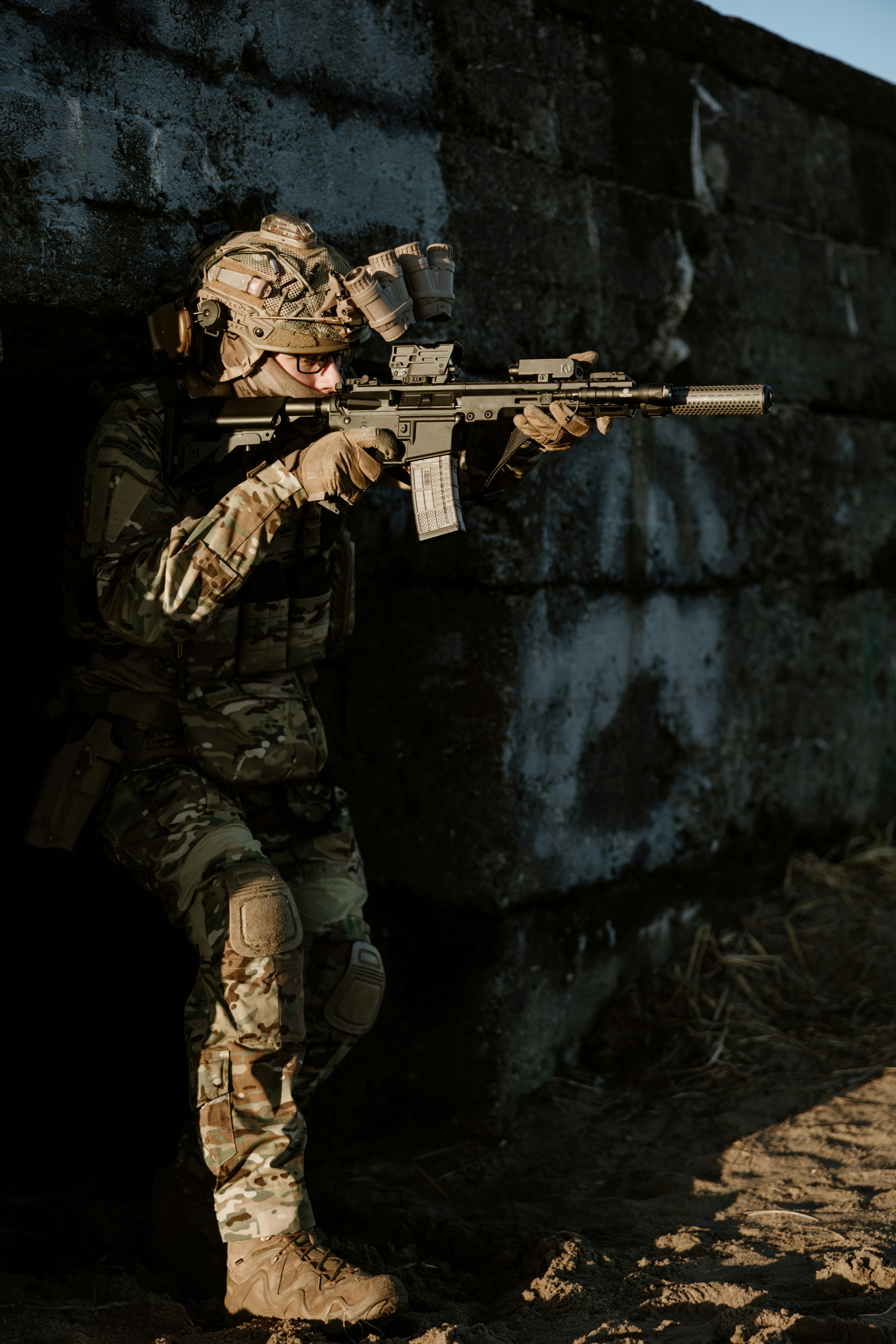Airsoft player wearing 8Fields Tactical gear and using Well Pro WE07 during the game