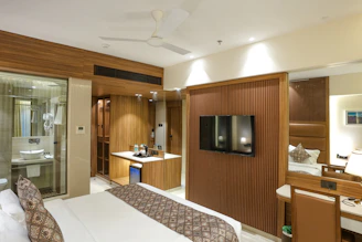 Luxurious hotel room with a modern design.