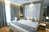 A luxurious hotel bedroom with stylish decor.