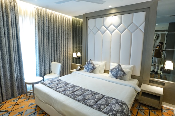 A luxurious hotel bedroom with stylish decor.