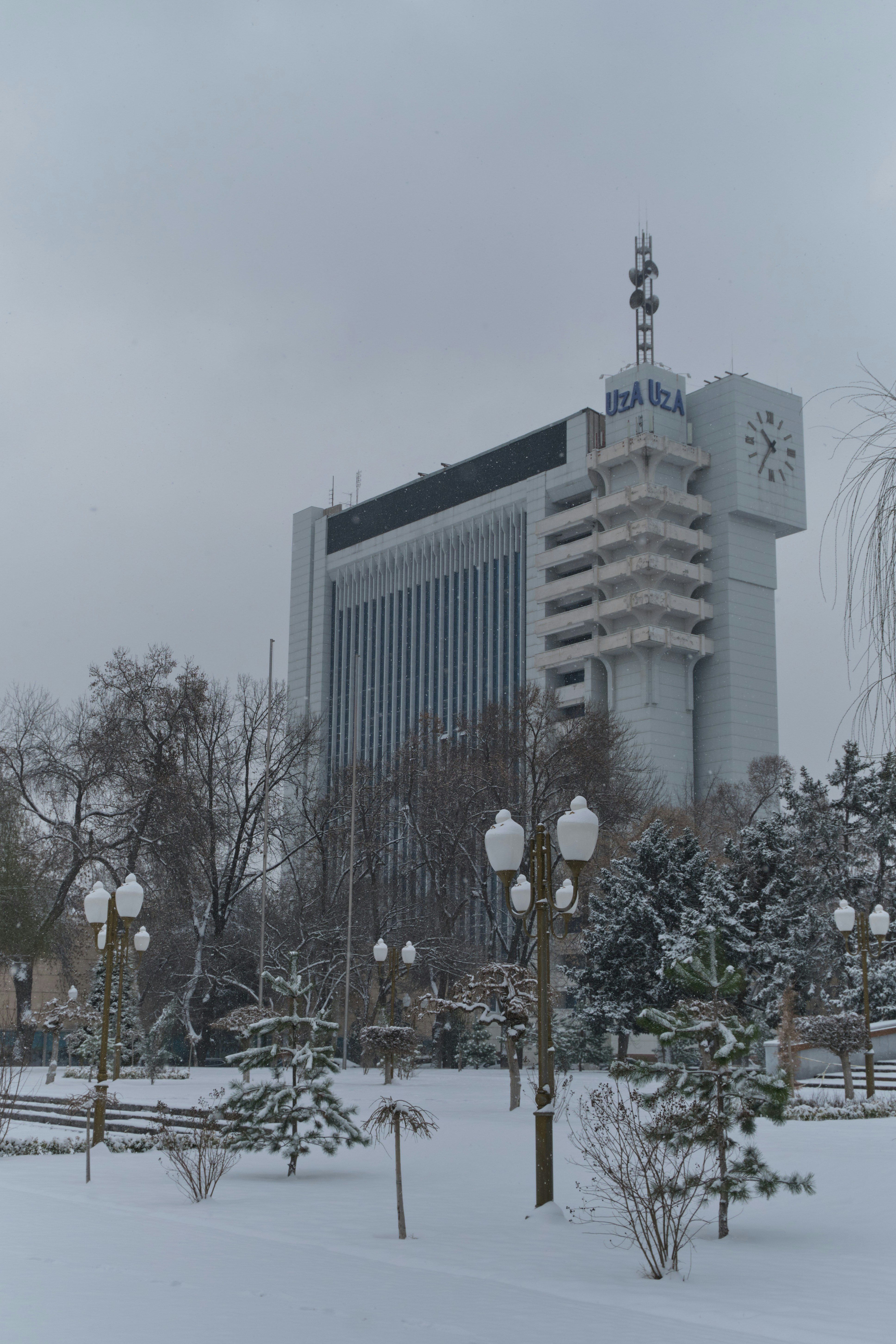 Snowy day view of a tall building.