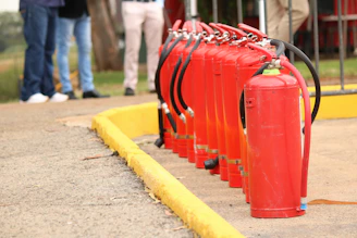 A line of red fire extinguishers stands ready.