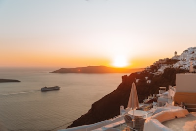 Sunset over the sea with a cruise ship.