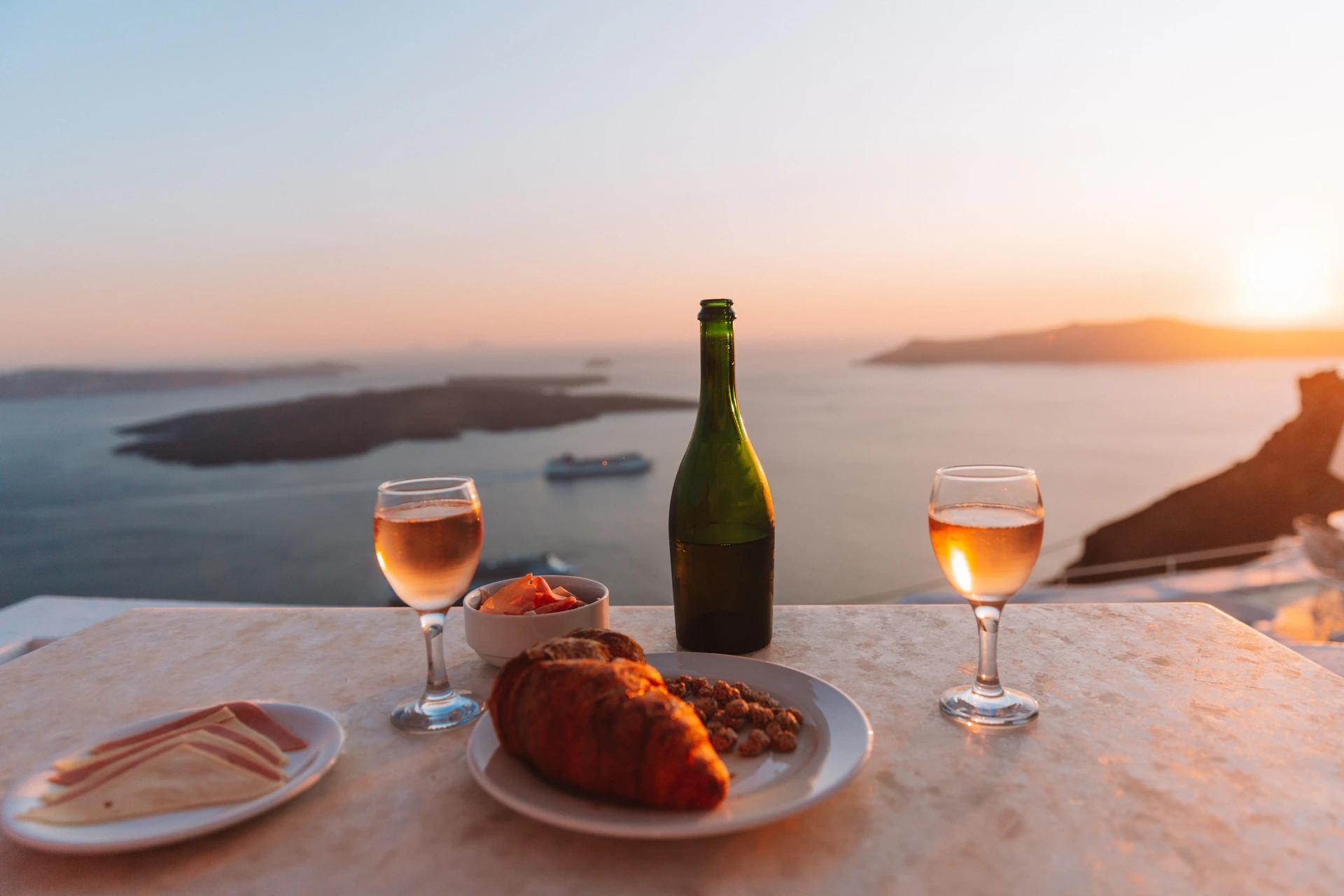 Private Santorini wine tasting experience at a clifftop vineyard overlooking the caldera