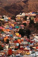Colorful buildings cascade down a hillside.