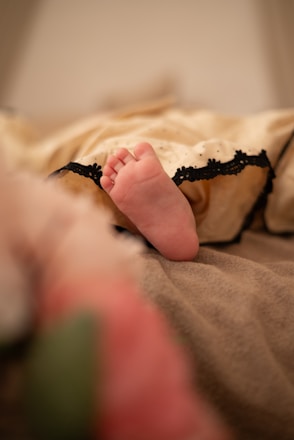 A baby's tiny foot in focus.
