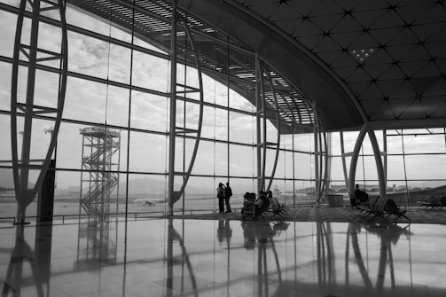 Inside an airport, looking out at a tower.