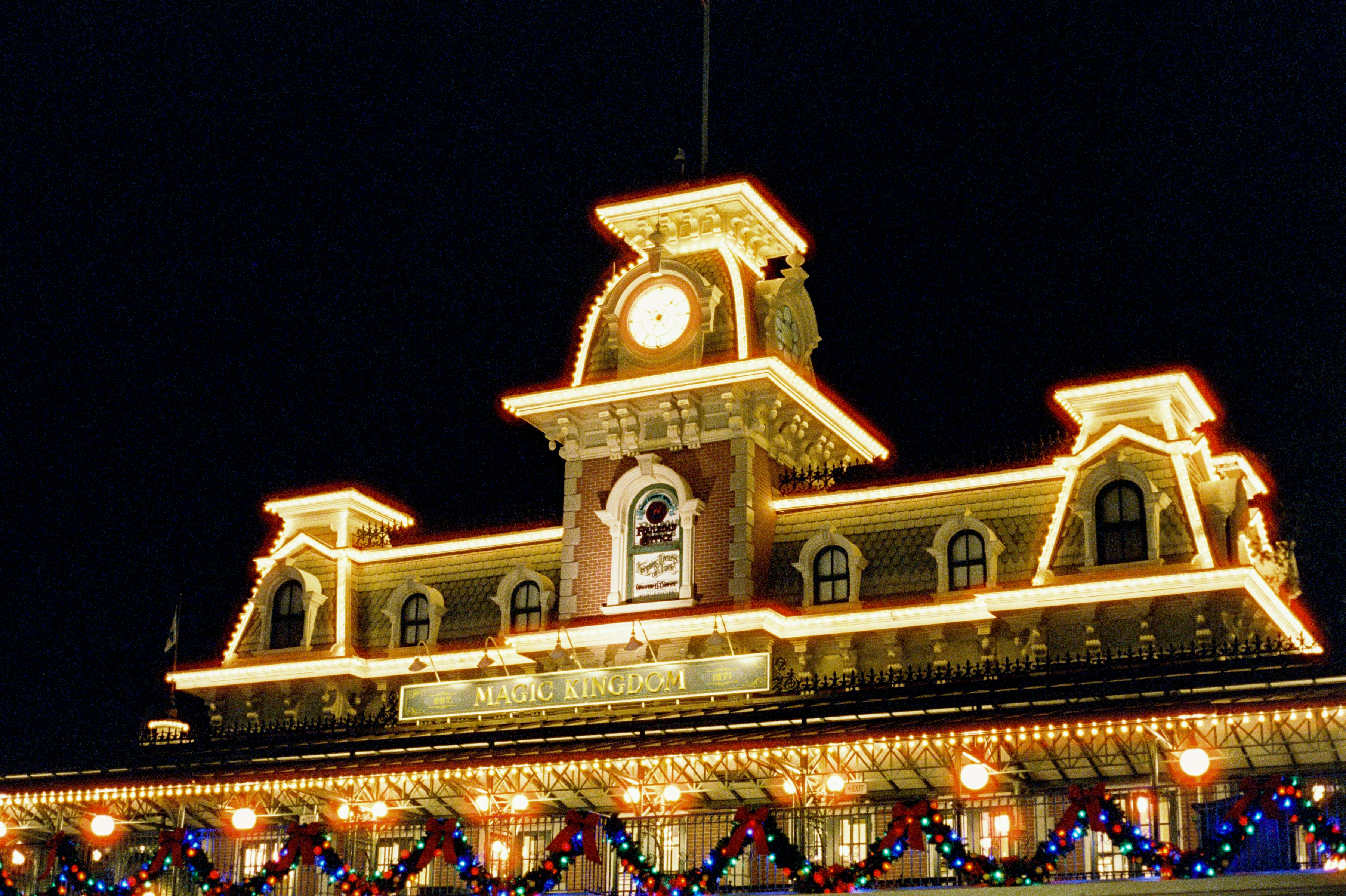The decorated train station shines at night.