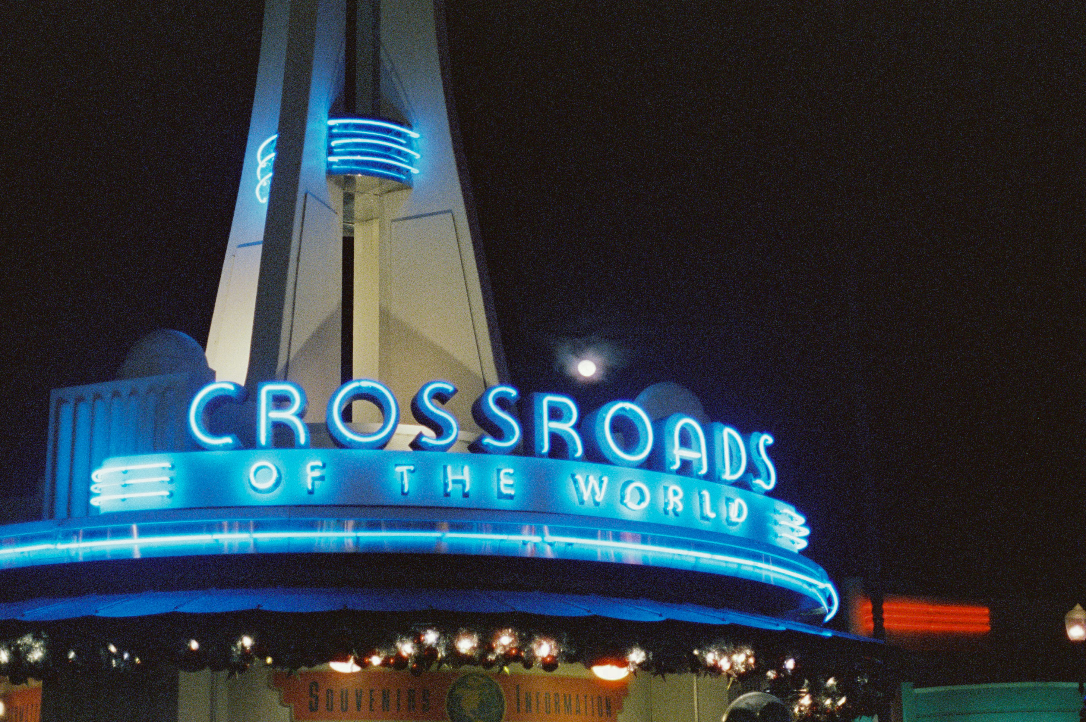Neon sign "crossroads of the world" at night.