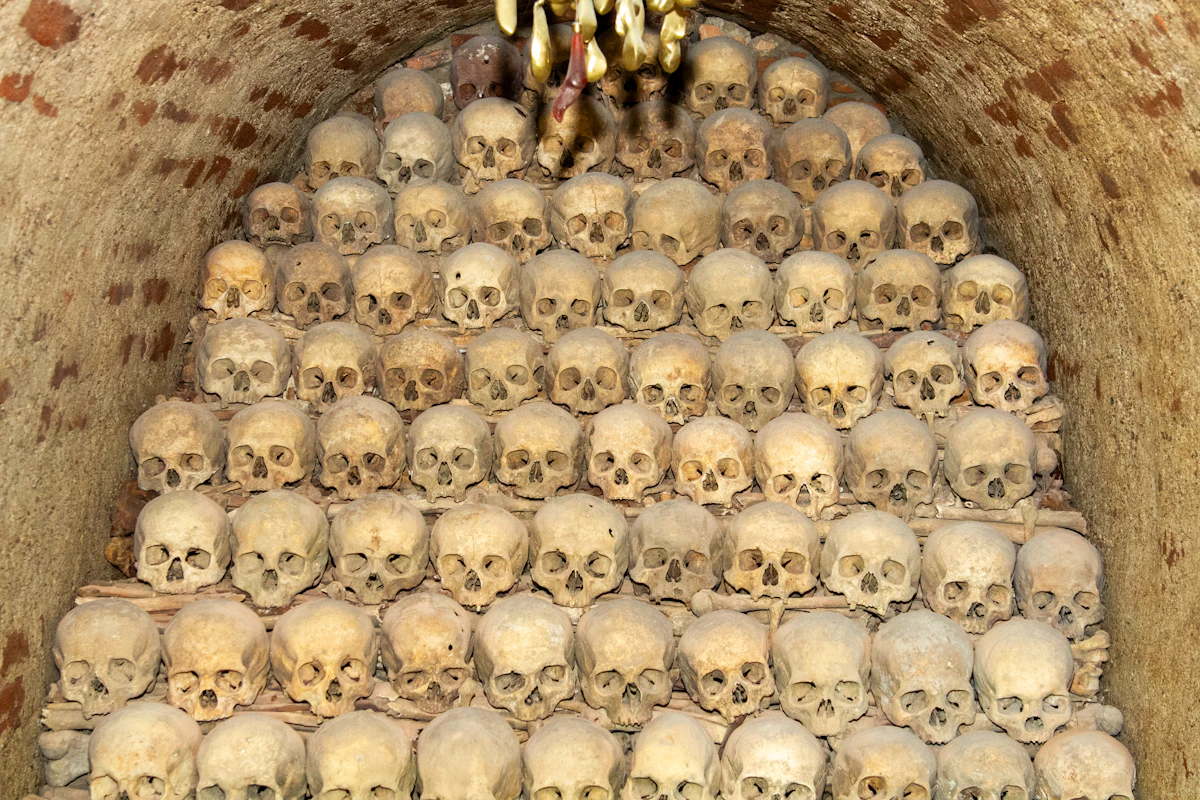Human bone chandelier and skull garlands inside Sedlec Ossuary, Kutná Hora, beneath the chapel's vaulted ceiling