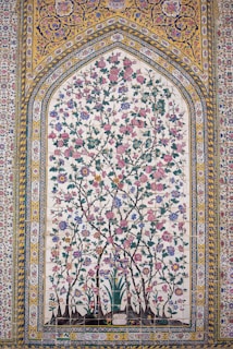 Colorful floral design on an ornate wall.