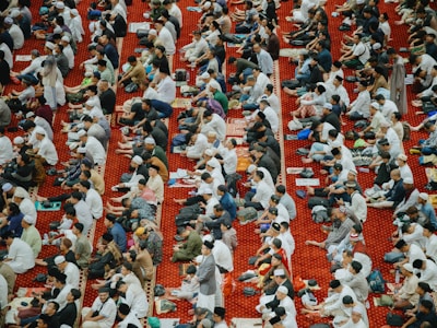 People are praying in a mosque.