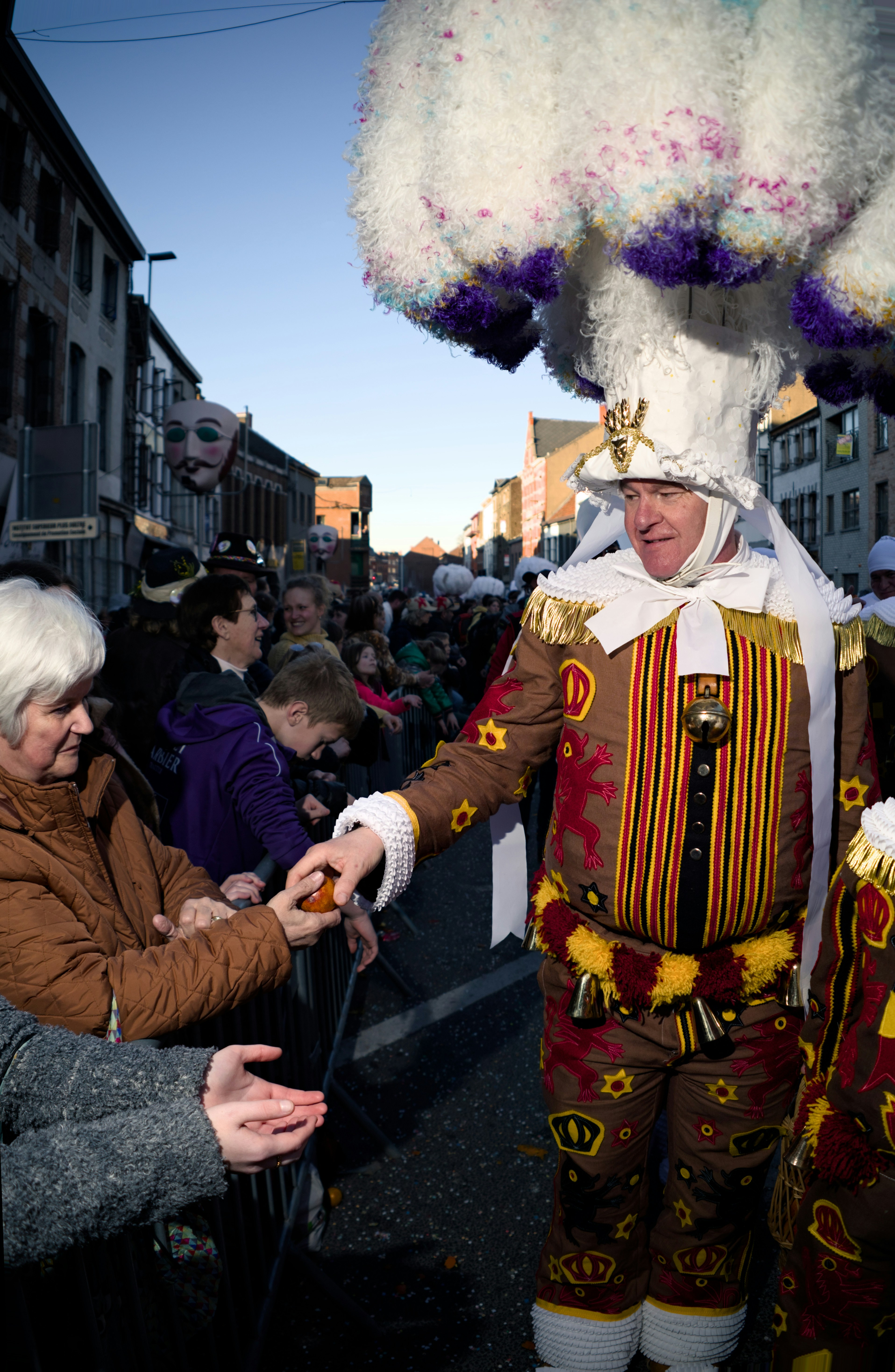 A man in a costume gives treats.