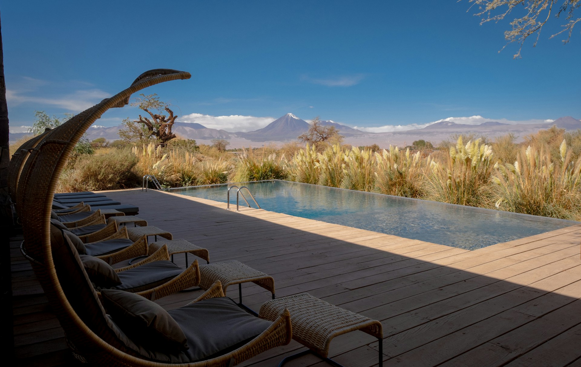 Poolside luxury with scenic mountain views.