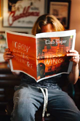 A person is reading a newspaper.