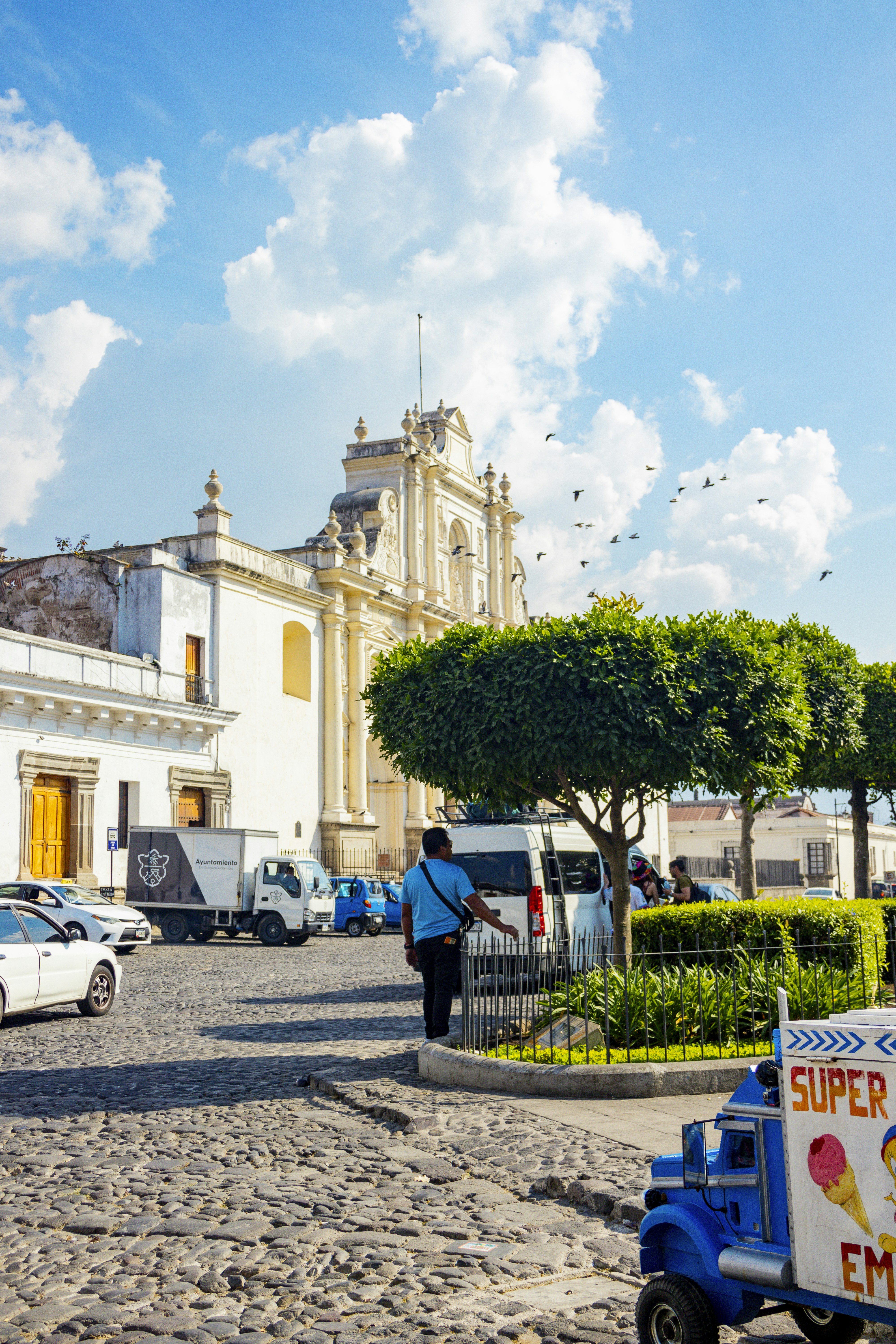 A plaza in guatemala with a beautiful church.