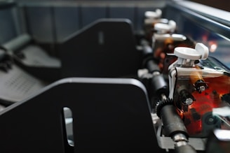 Inside the printer, showing intricate gears and parts.