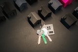 Keys representing a new home and many house models.
