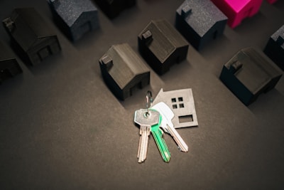 Keys representing a new home and many house models.
