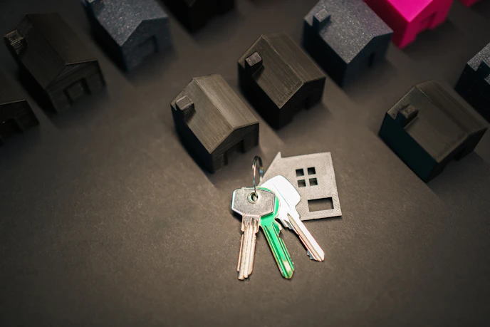 Keys representing a new home and many house models.