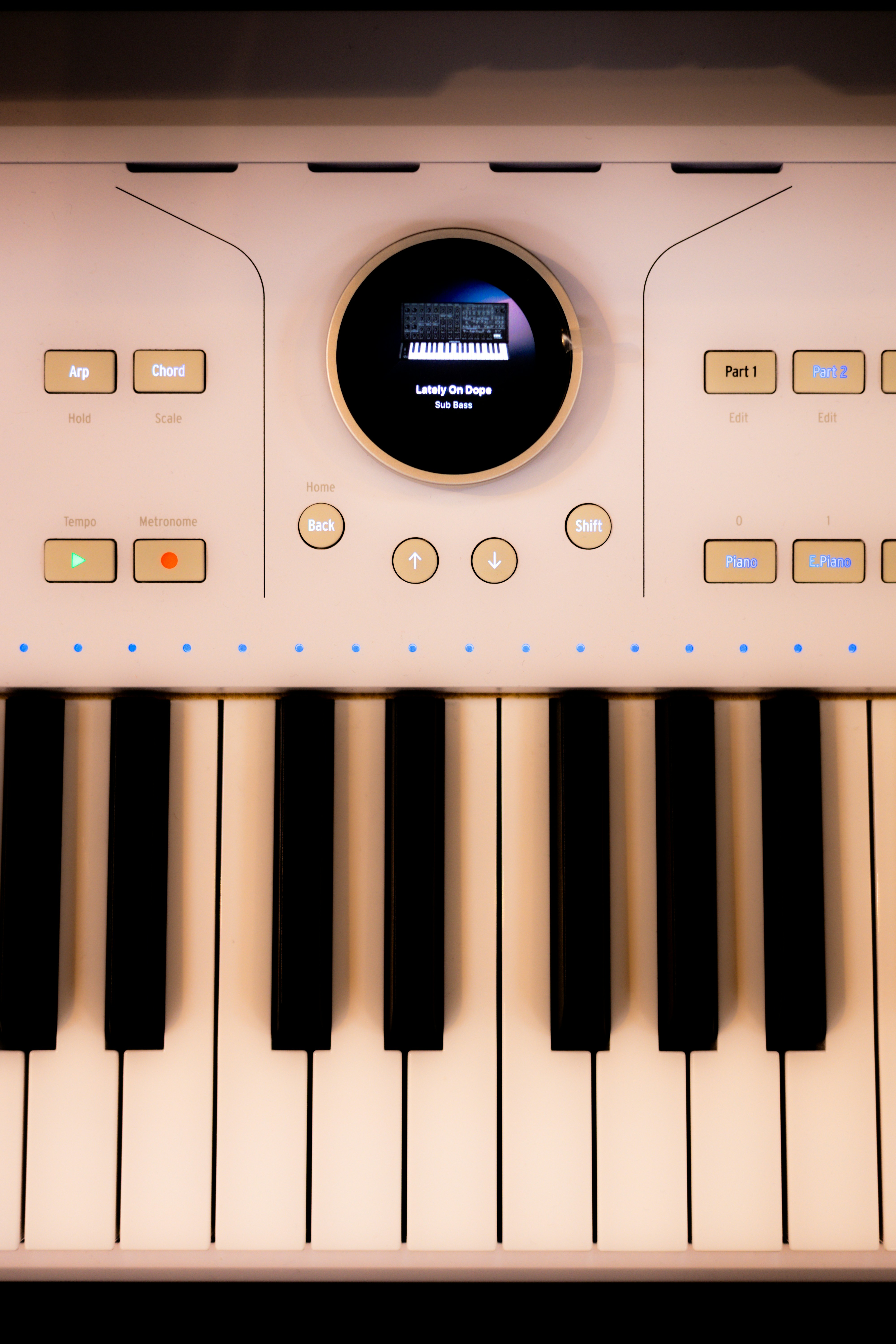 A close-up shows a modern electronic keyboard.