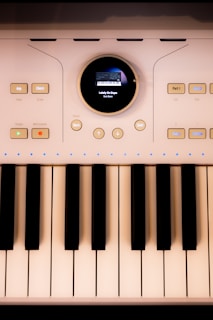 A close-up shows a modern electronic keyboard.