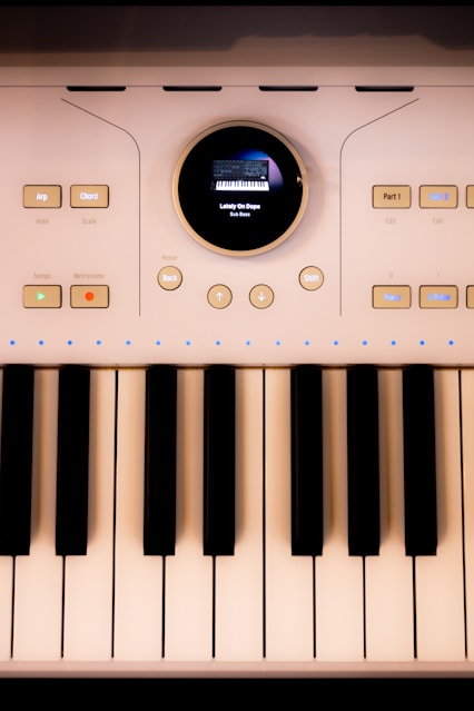 A close-up shows a modern electronic keyboard.
