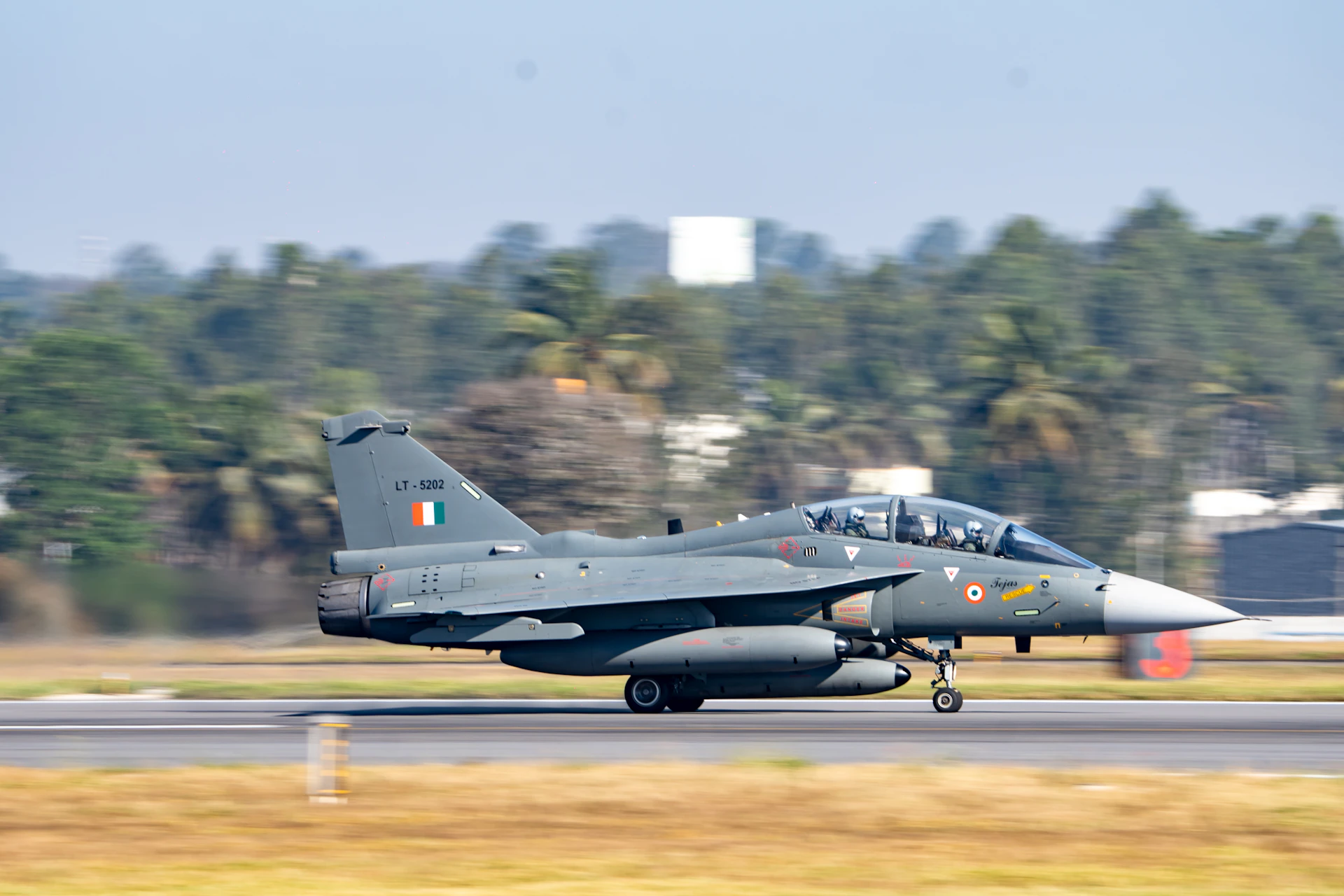 An indian air force fighter jet landing.