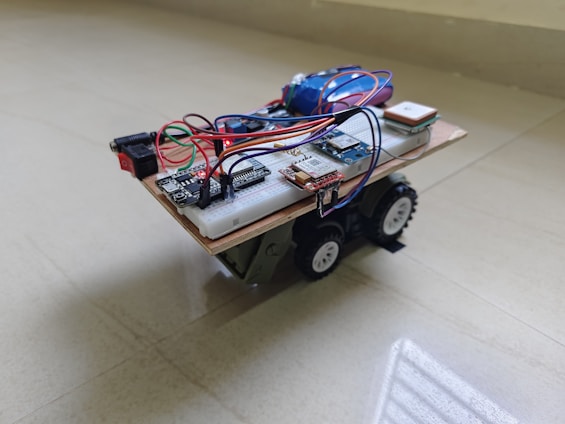 A custom-built robot sits on a light-colored floor.