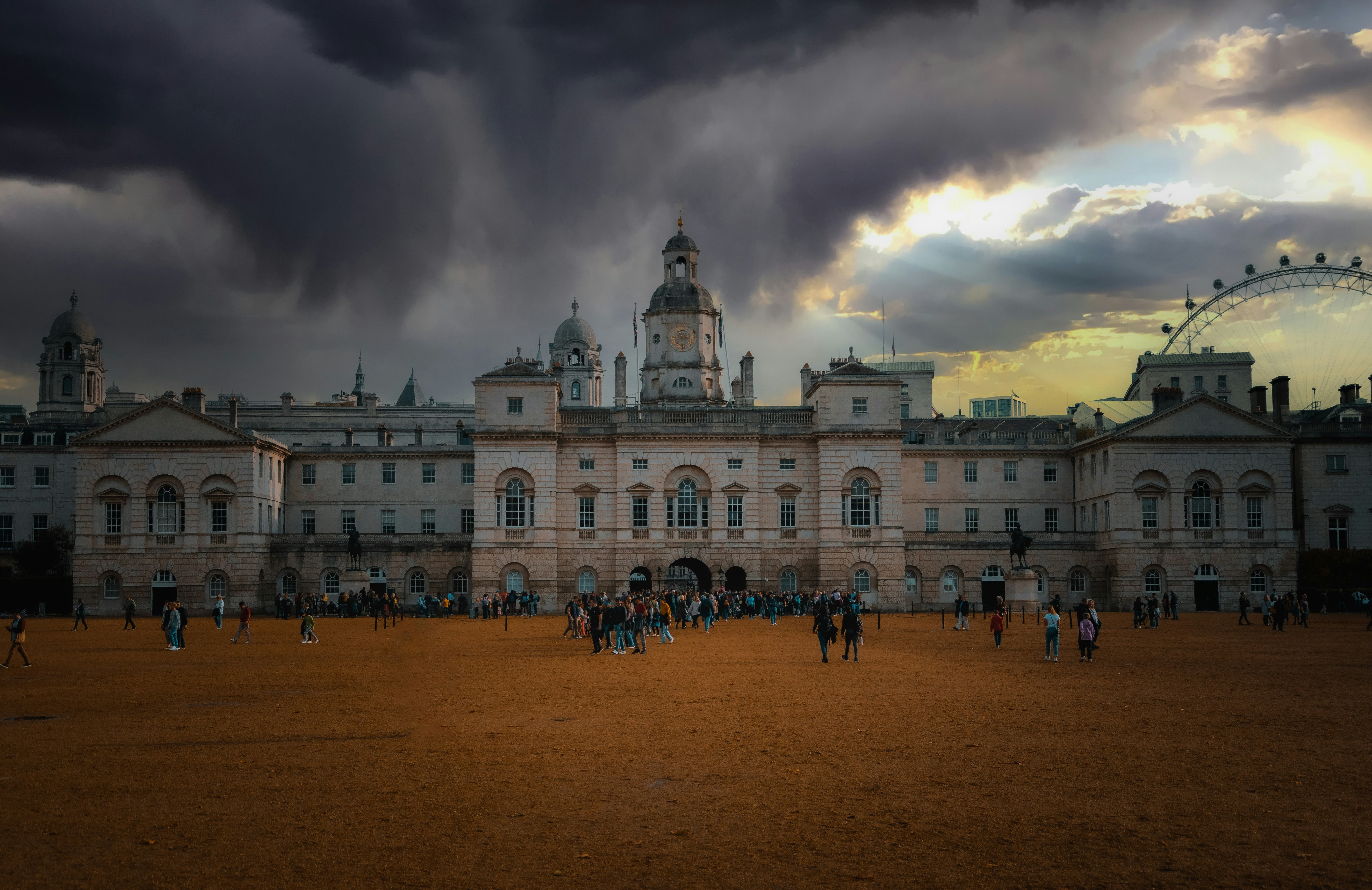 London buildings stand beneath a dramatic sky.