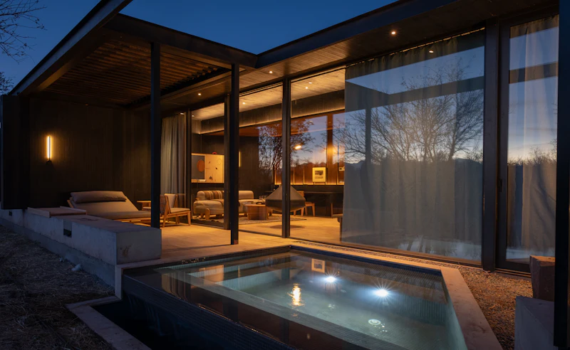 Modern home and pool photographed at dusk