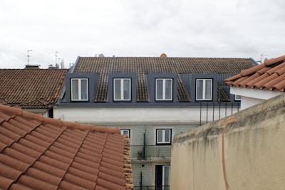 Buildings with tiled roofs and dormer windows.