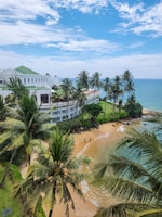 Beachfront resort under a bright blue sky.
