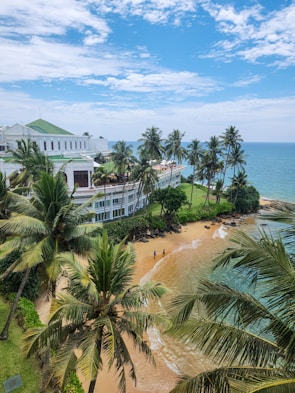 Beachfront resort under a bright blue sky.