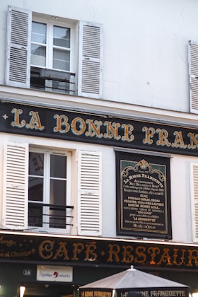 A cafe-restaurant sign in paris, france.