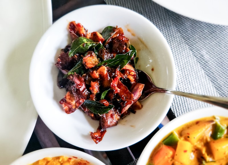 Sri Lankan black pork curry with dark roasted coconut and curry leaves